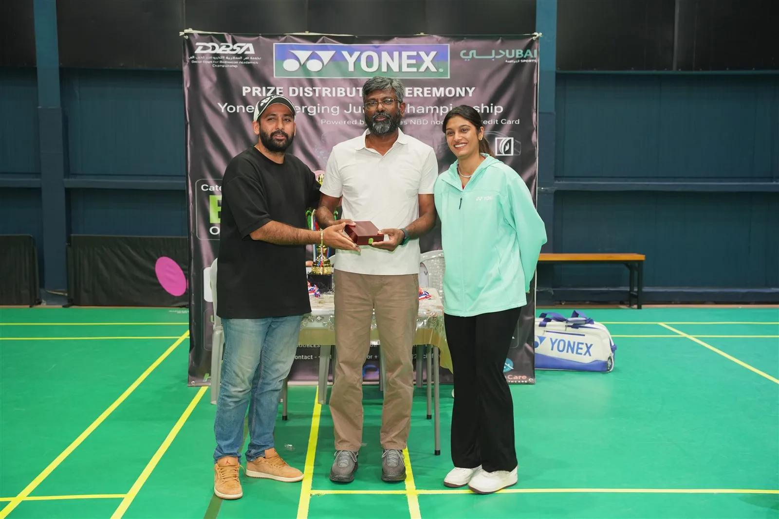 Yonex award presentation on an indoor badminton court